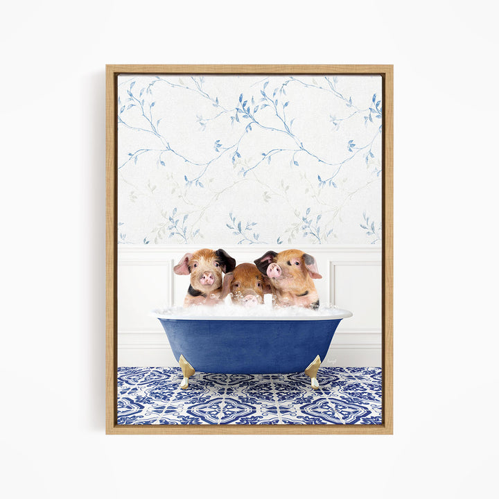 Three adorable pigs sitting in a blue bathtub, with a floral patterned wall behind them.