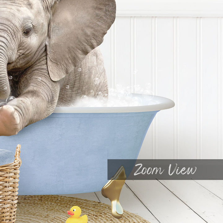 A baby elephant sitting in a blue bathtub, surrounded by a yellow rubber duck and a basket.