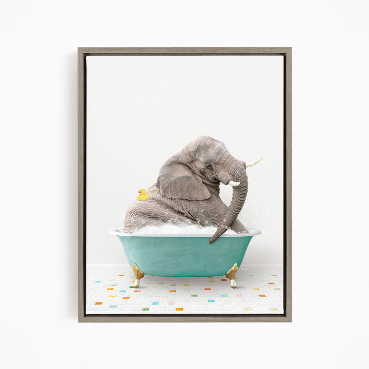 A gray elephant is sitting in a blue bathtub, surrounded by a yellow rubber duck.