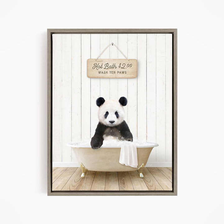 A panda bear sitting in a bathtub, with a sign above that reads "Hot Bath $2.00 WASH YOUR Paws".