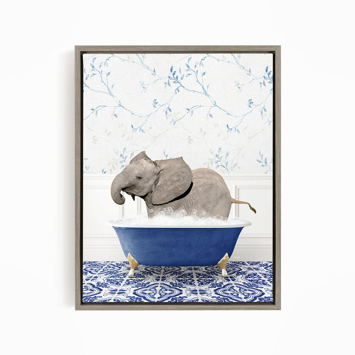 A gray elephant is sitting in a blue bathtub filled with water, surrounded by a blue and white patterned floor.