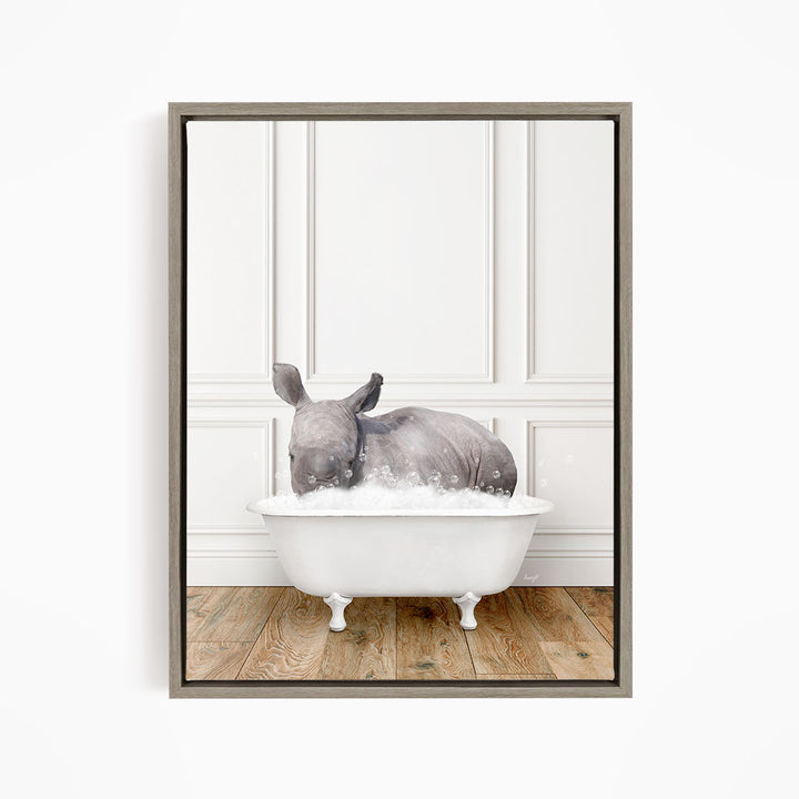 A rhinoceros is sitting in a white bathtub filled with water, creating a whimsical and playful scene.