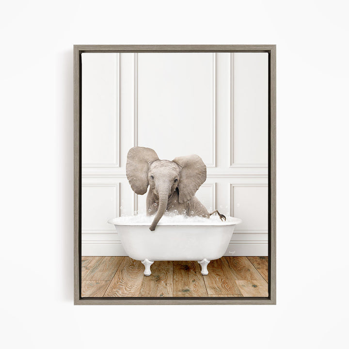 A baby elephant sitting in a white bathtub filled with water, with its trunk submerged in the water.