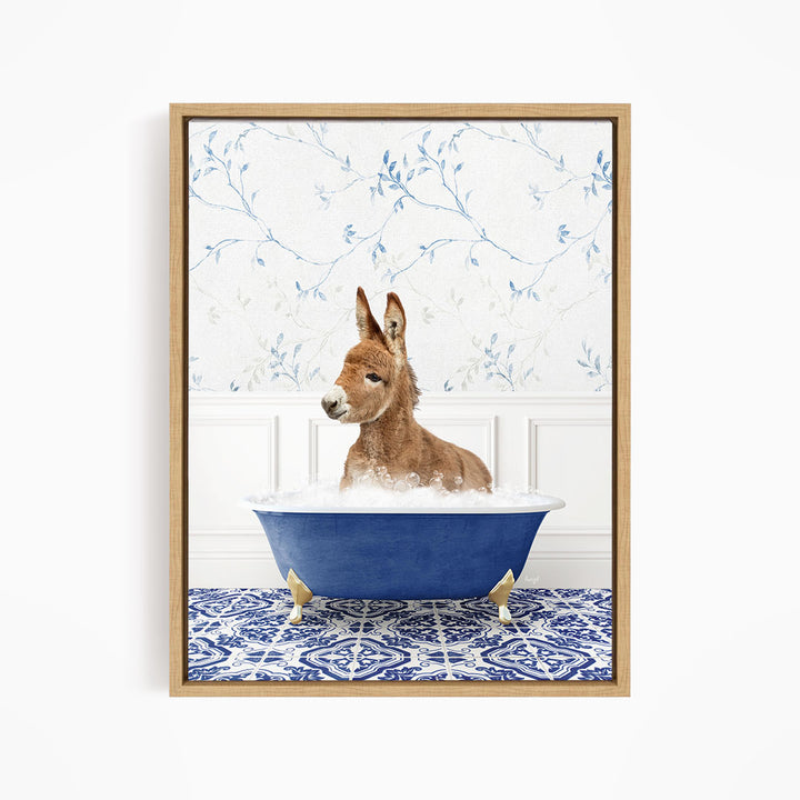 A donkey is sitting in a blue bathtub filled with water, surrounded by a patterned tile floor and a floral wallpaper background.