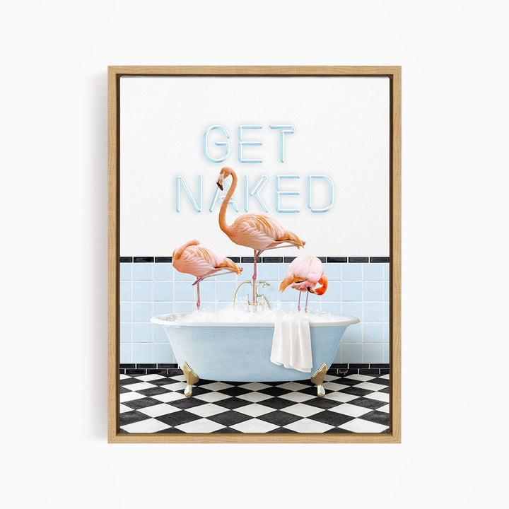 A framed image depicting three flamingos standing in a bathtub, with the text "GET NAKED" displayed above them.