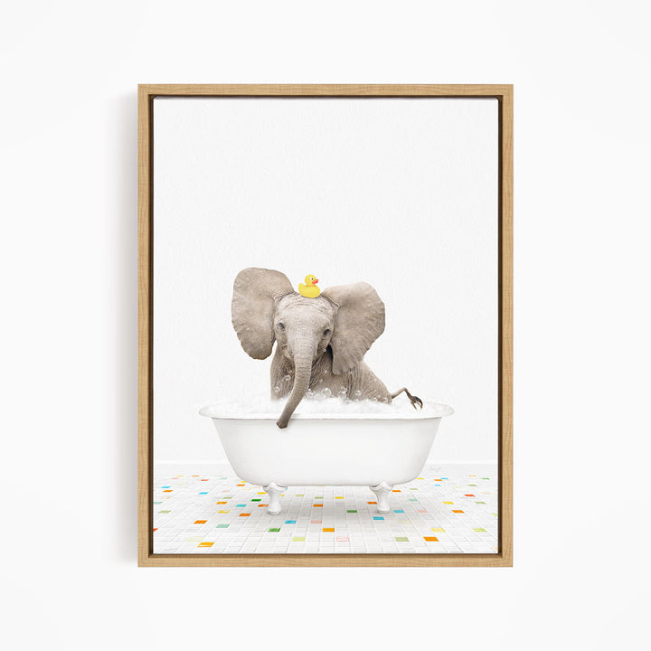 A baby elephant sitting in a white bathtub, with a yellow rubber duck on its head, enjoying a bath.