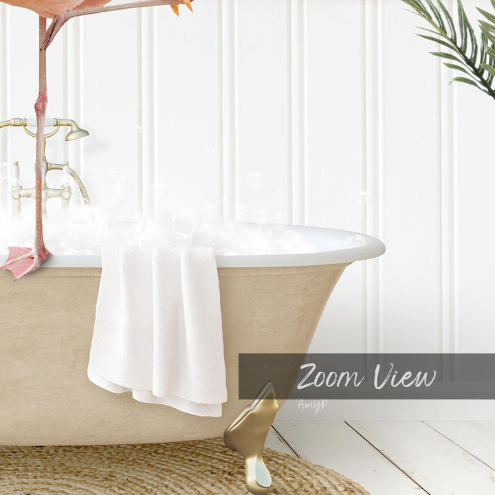 A white claw-foot bathtub filled with bubbles, with a towel hanging on the side and a plant in the background.