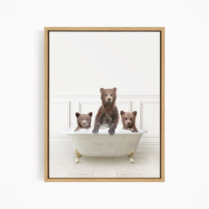 Three brown bears sitting in a white bathtub, with one bear sitting in the center and the other two bears sitting on either side.