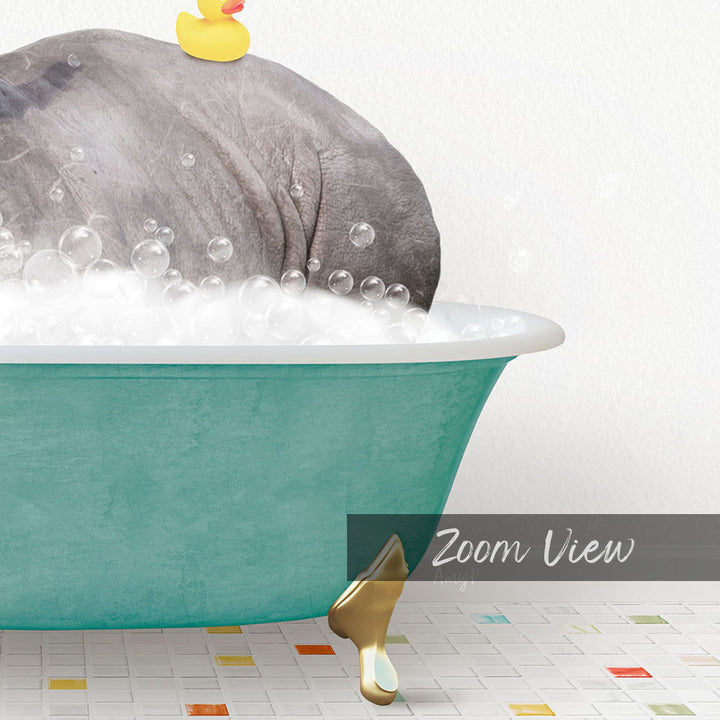 A large gray elephant is sitting in a green bathtub filled with bubbles, with a yellow rubber duck floating on top.
