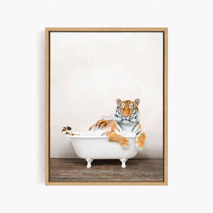 A tiger is sitting in a white bathtub, appearing relaxed and enjoying the bath.