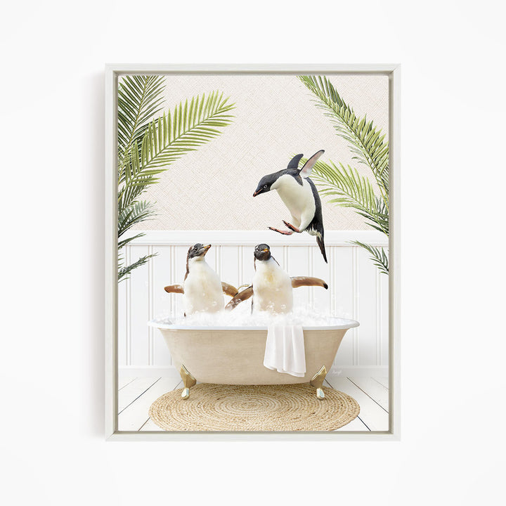 A framed image depicting two penguins sitting in a bathtub, surrounded by palm leaves, creating a whimsical and playful scene.