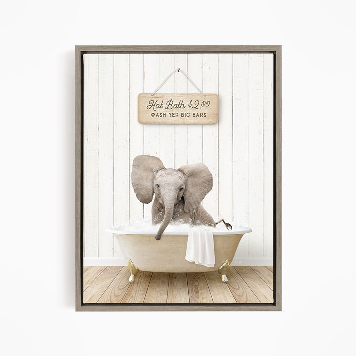 A gray elephant is sitting in a white bathtub, with a wooden sign above it that reads "Hot Bath $2.00 WASH FOR BIG EARS".