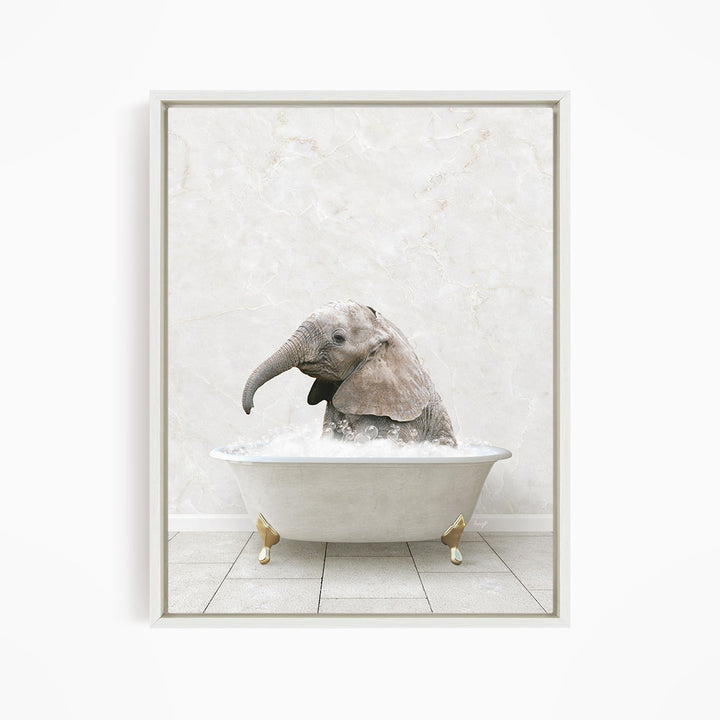 A baby elephant sitting in a white bathtub filled with water, appearing to enjoy the bath.
