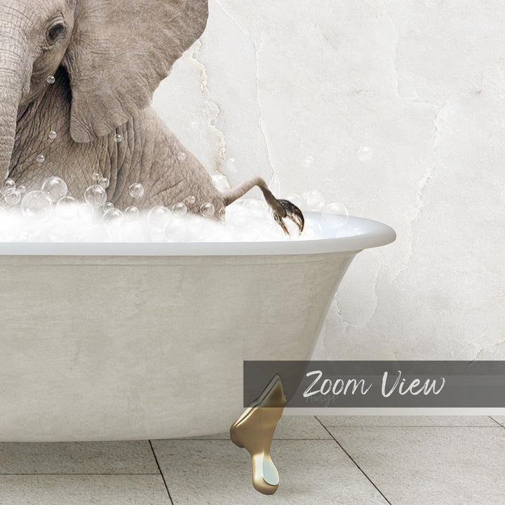 A large elephant is sitting in a bathtub filled with bubbles, with its trunk submerged in the water.