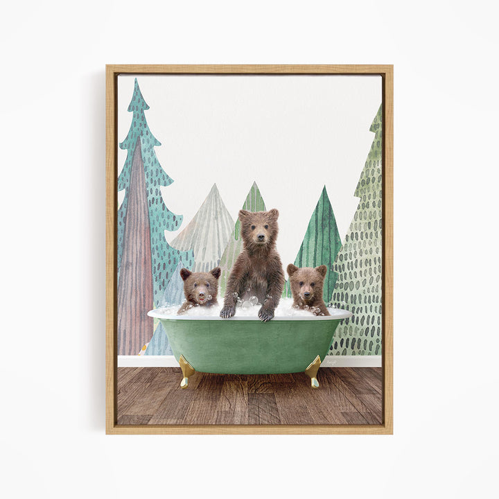 A framed print depicting three bears sitting in a green bathtub, with a forest scene in the background.