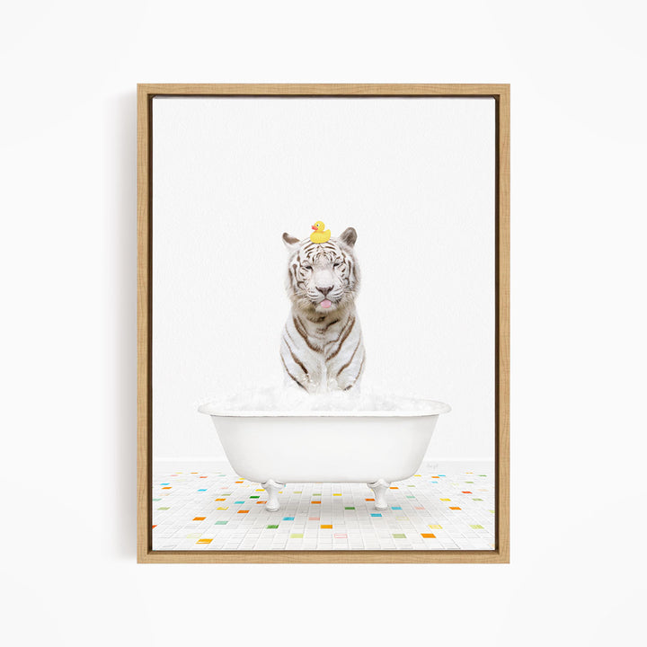 A white tiger is sitting in a white bathtub, with a yellow rubber duck perched on its head.