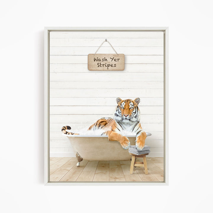A tiger is sitting in a bathtub, with a sign above it that says "Wash Yer Stripes".