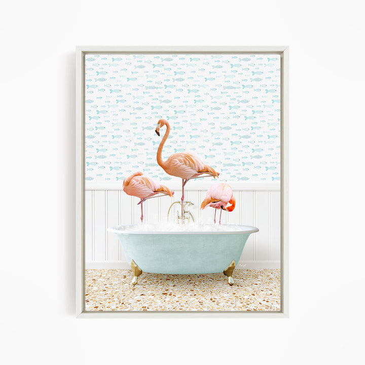 A framed image depicting three flamingos standing in a bathtub filled with water, with a fish-themed wallpaper in the background.