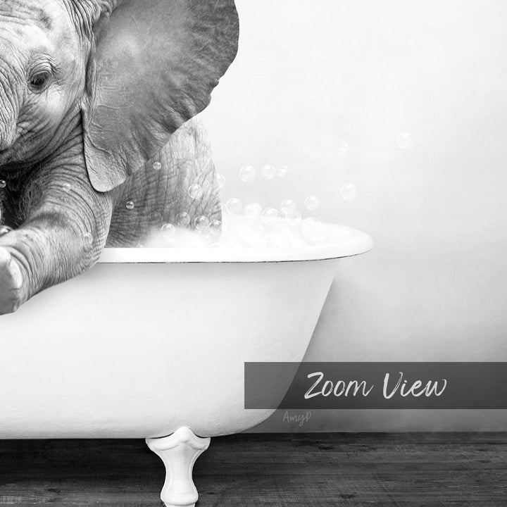 A baby elephant sitting in a bathtub filled with bubbles, creating a whimsical and playful scene.