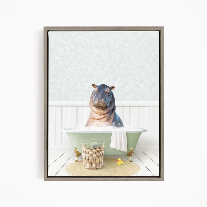 A hippopotamus sitting in a green bathtub filled with water, surrounded by a basket of toys and a yellow rubber duck.