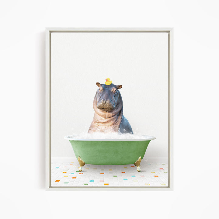 A hippopotamus sitting in a green bathtub filled with bubbles, with a yellow rubber duck perched on its head.