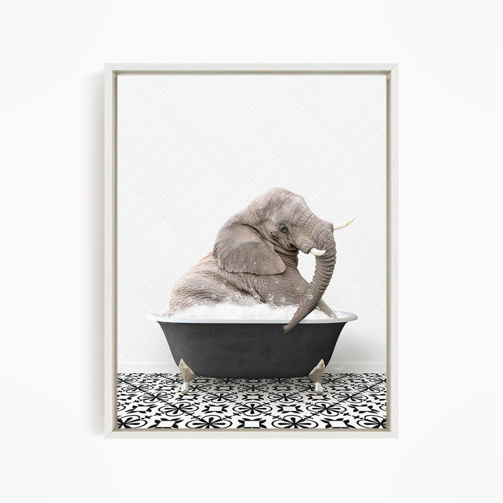A gray elephant sitting in a black bathtub filled with water, surrounded by a black and white patterned floor.