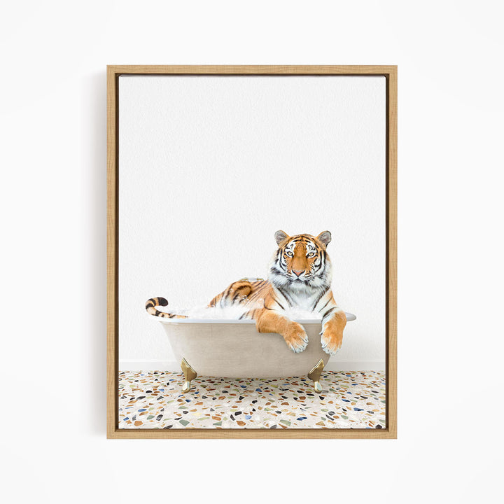 A tiger is sitting in a white bathtub, appearing relaxed and comfortable.
