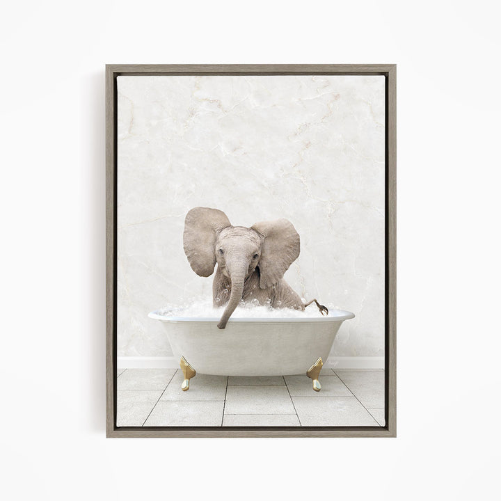 A baby elephant sitting in a white bathtub filled with water, with its trunk submerged in the water.