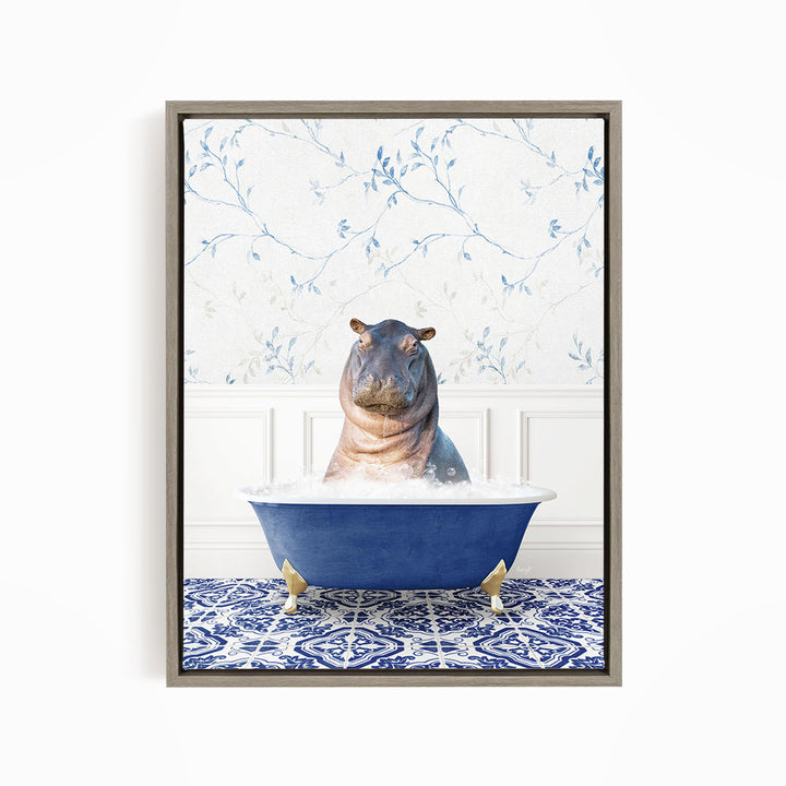 A hippopotamus sitting in a blue bathtub, surrounded by a patterned tile floor and a floral wallpaper background.