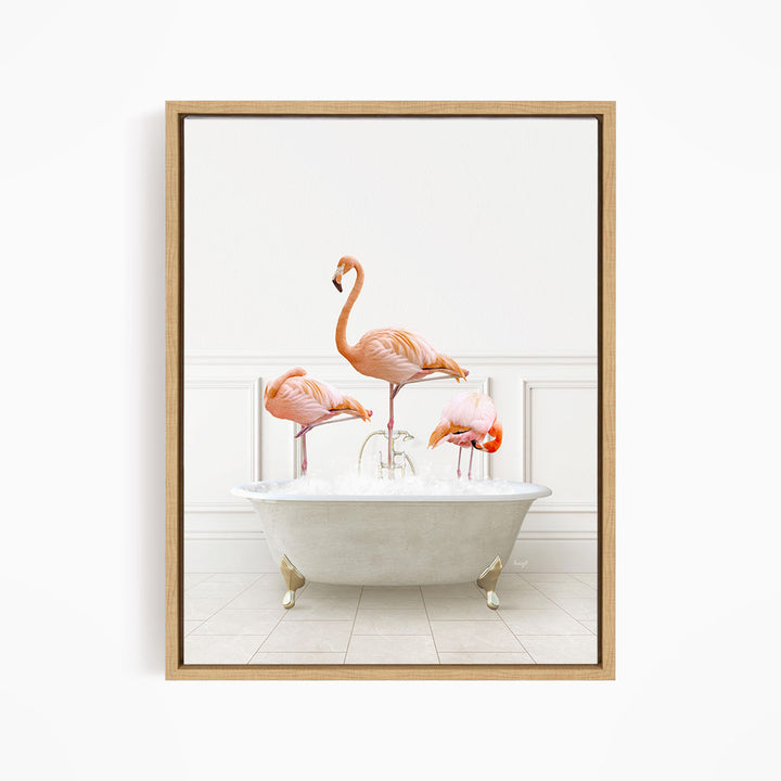 A framed image depicting three pink flamingos standing in a white bathtub filled with water.
