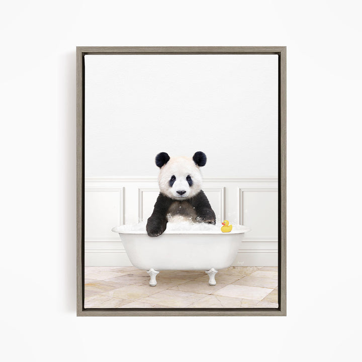 A panda bear sitting in a white bathtub, with a rubber duck floating in the water.