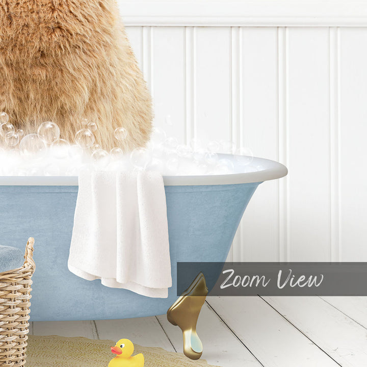 A fluffy brown dog is sitting in a blue bathtub filled with bubbles, with a yellow rubber duck nearby.