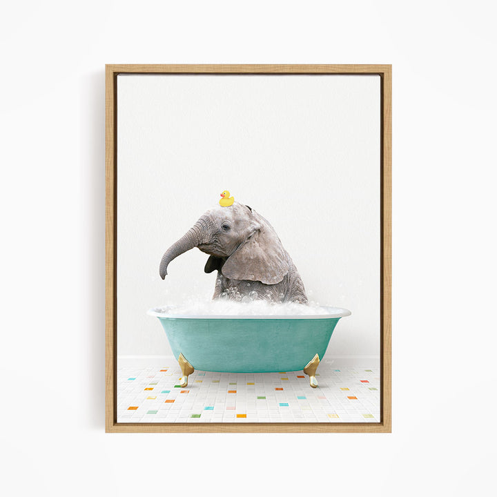 A gray elephant is sitting in a blue bathtub, with a yellow rubber duck perched on its head.