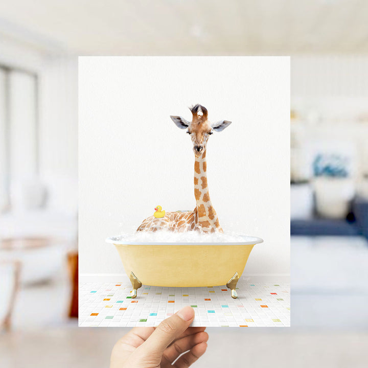 A giraffe sitting in a yellow bathtub filled with bubbles, with a rubber duck floating nearby.