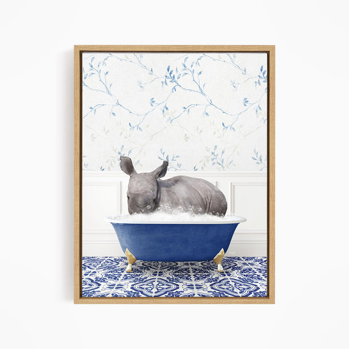 A rhinoceros is sitting in a blue bathtub filled with water, surrounded by a blue and white patterned floor.