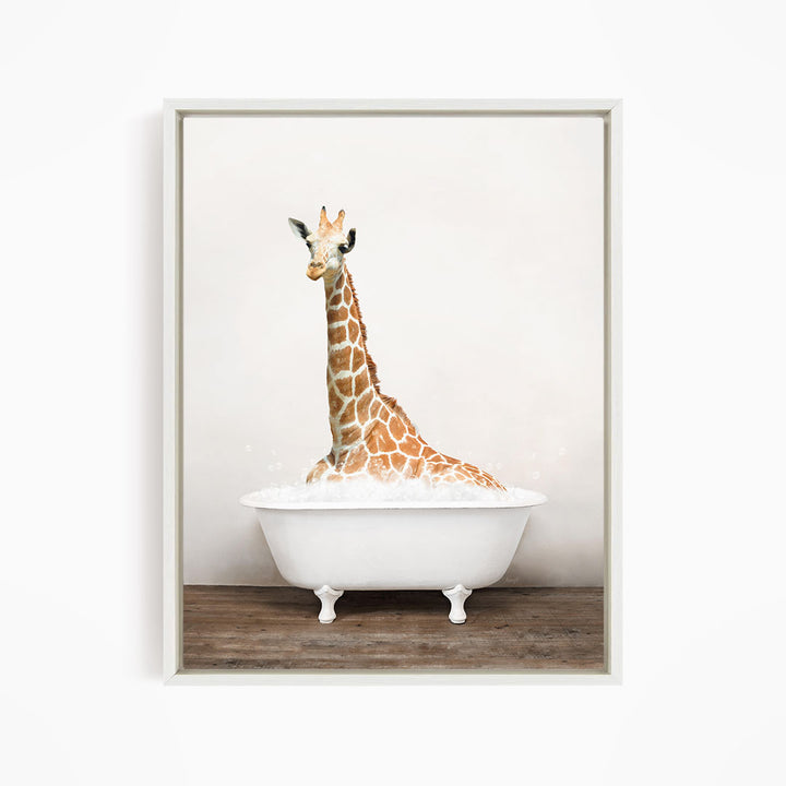 A giraffe sitting in a white bathtub filled with bubbles, creating a whimsical and playful scene.