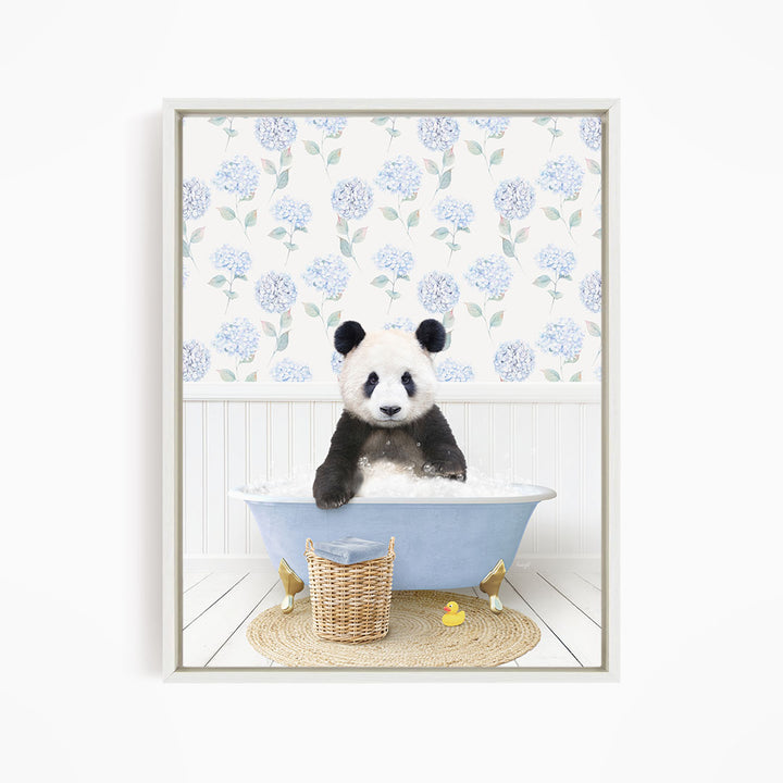 A panda bear sitting in a blue bathtub filled with bubbles, surrounded by a wicker basket and a yellow rubber duck.
