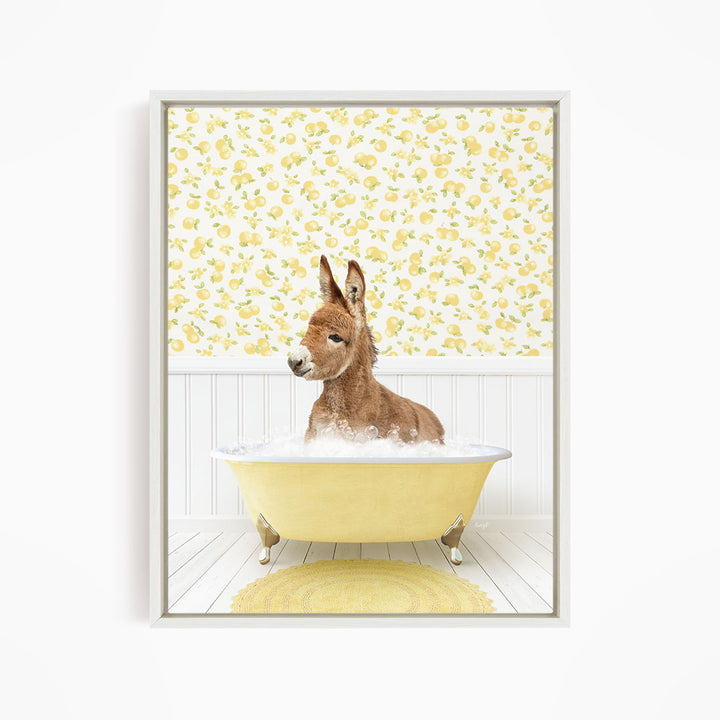 A donkey is sitting in a yellow bathtub filled with water, surrounded by a yellow and white floral patterned wall.