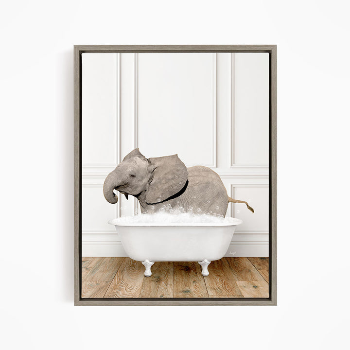 A gray elephant is sitting in a white bathtub filled with water, creating a whimsical and playful scene.