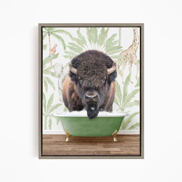 A buffalo is sitting in a green bathtub, surrounded by tropical foliage and a giraffe in the background.