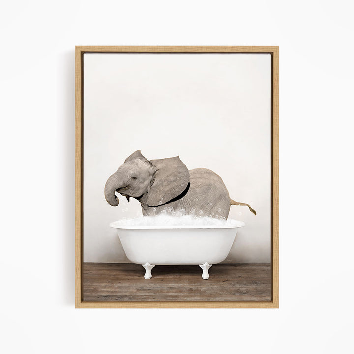 A gray elephant is sitting in a white bathtub filled with water, creating a whimsical and playful scene.