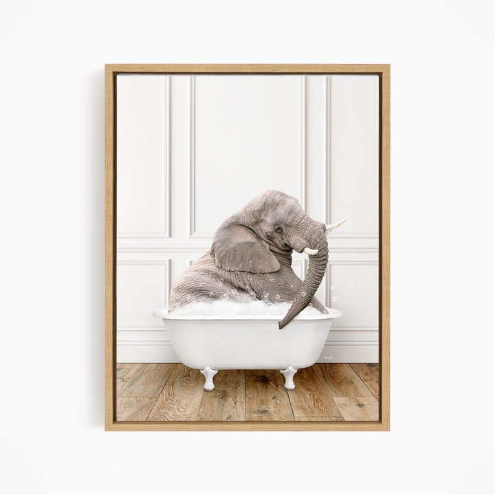 A gray elephant is sitting in a white bathtub filled with bubbles, creating a whimsical and playful scene.