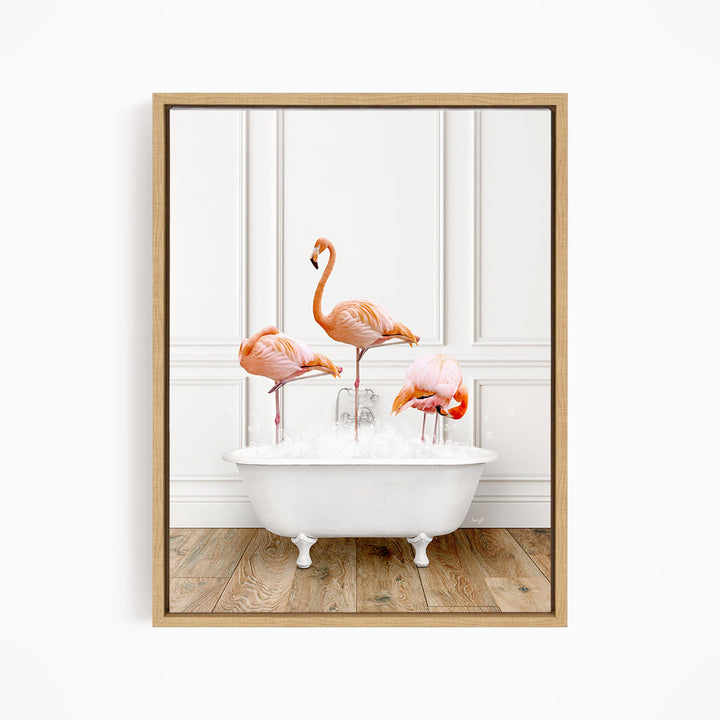 A framed image depicting three flamingos standing in a white bathtub filled with water.