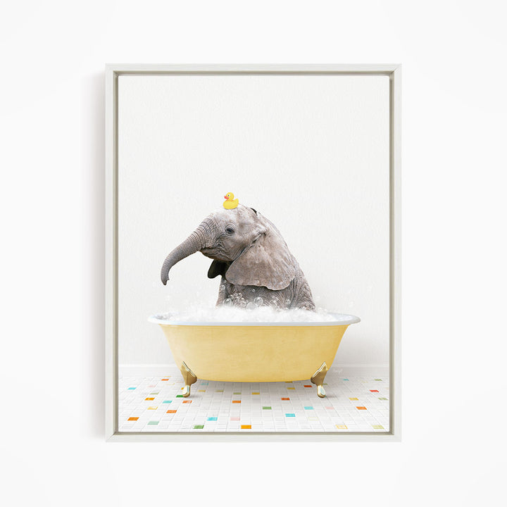 A gray elephant is sitting in a yellow bathtub, with a yellow rubber duck perched on its head.