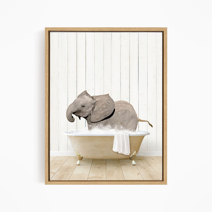 A gray elephant is sitting in a white bathtub filled with water, creating a whimsical and playful scene.