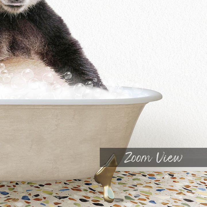 A cat is sitting in a bathtub filled with bubbles, with a gold faucet visible.