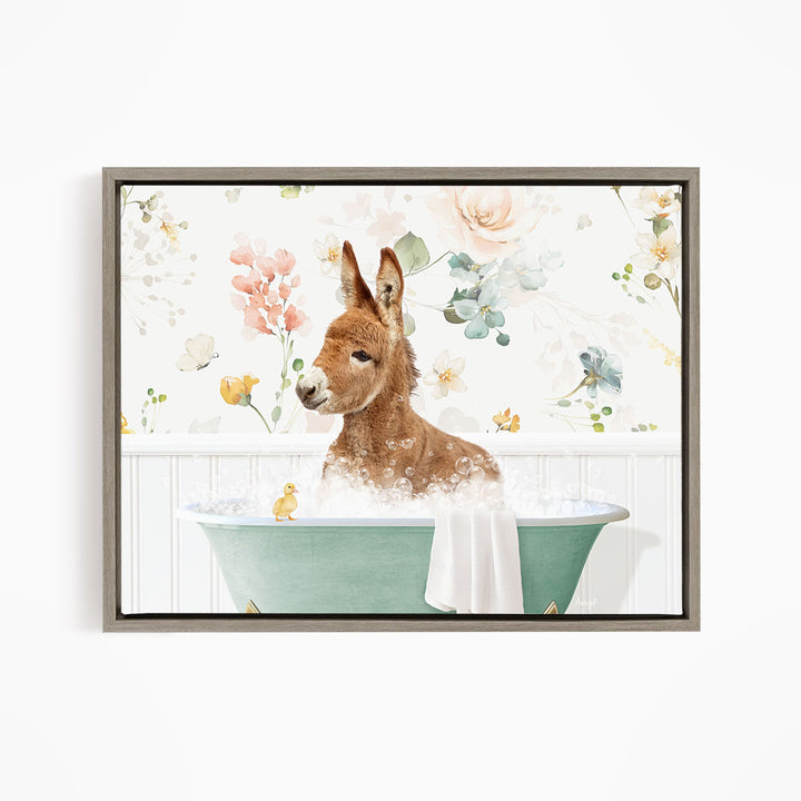 A brown donkey is sitting in a green bathtub filled with bubbles, surrounded by a floral pattern.