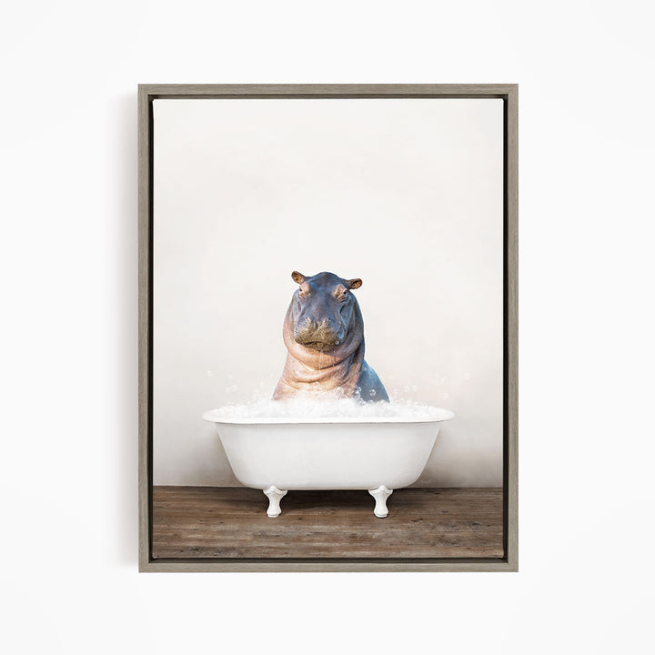 A hippopotamus sitting in a white bathtub filled with water, creating a whimsical and playful scene.