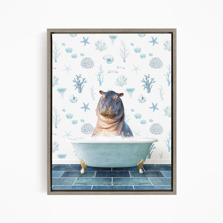 A framed image depicting a hippopotamus sitting in a bathtub filled with water, surrounded by a pattern of blue and white seashells and starfish.