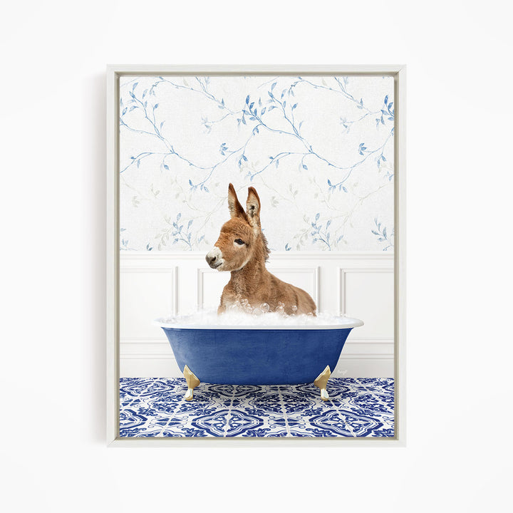 A donkey is sitting in a blue bathtub filled with bubbles, surrounded by a blue and white patterned floor.